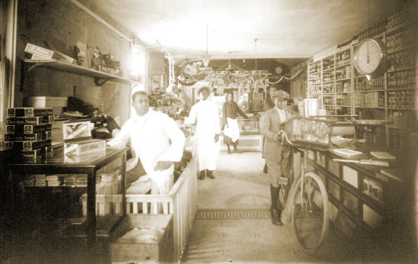 Another Interior View of the Palace Market. Frank Butler is on left, in white.